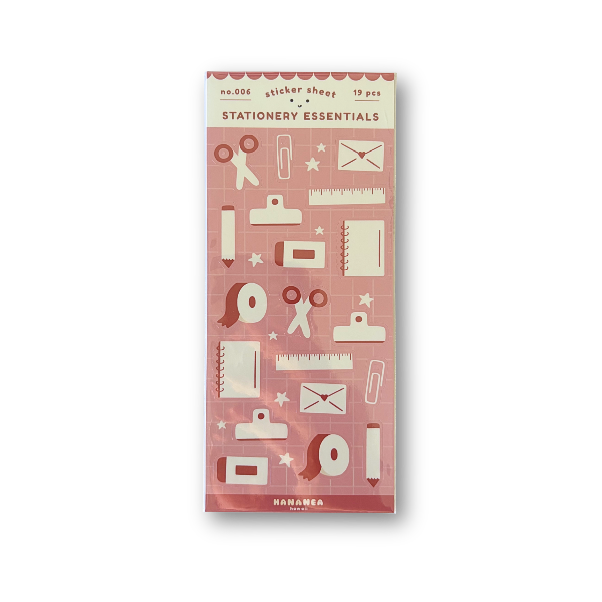 A tall, narrow package of 'Stationery Essentials' stickers, featuring a dusty pink background with cream-colored illustrations of office and desk items like pens, scissors, rulers, and envelopes.