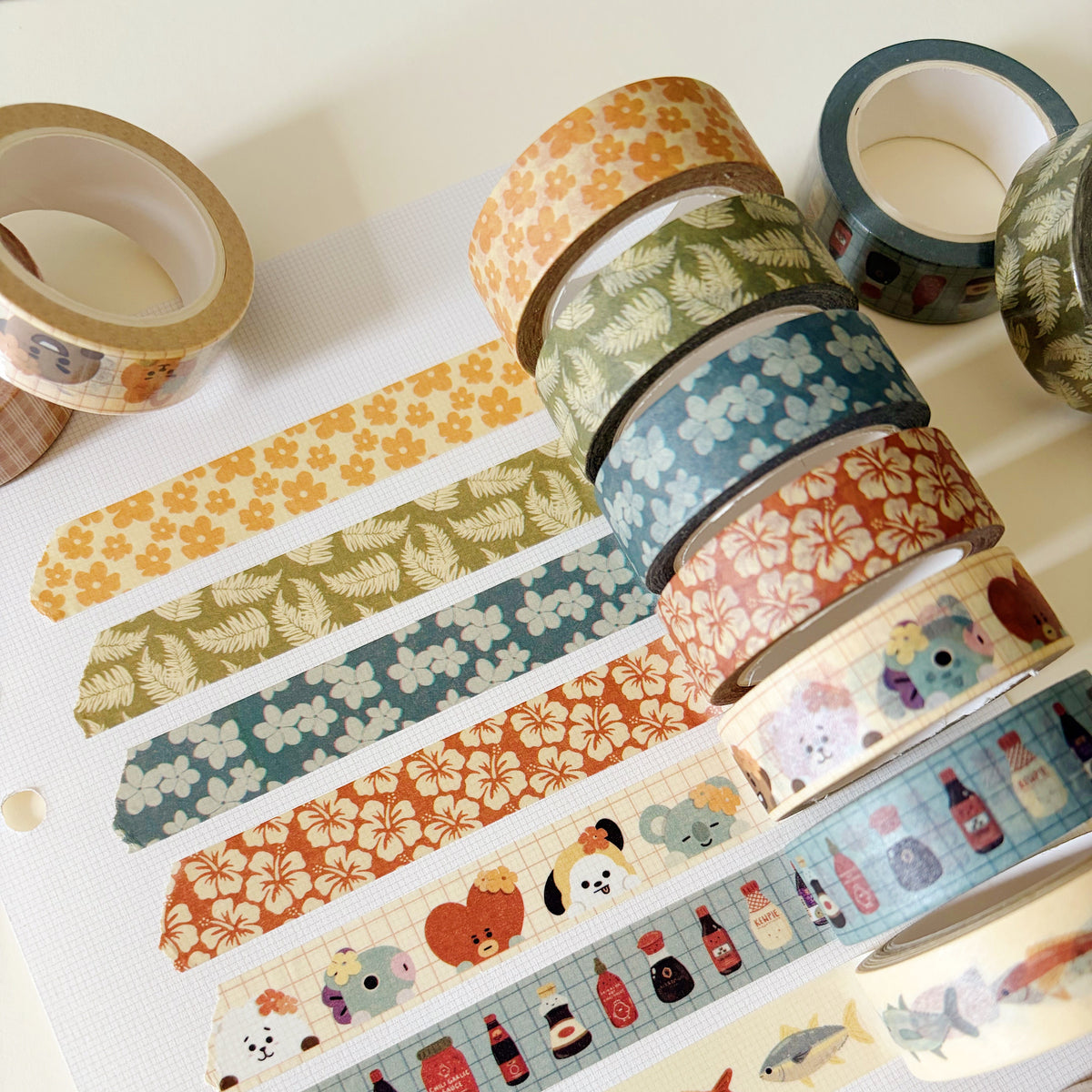 Rolls of washi tape displayed on a white paper.