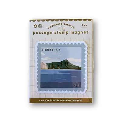 A postage stamp magnet product shown in its retail packaging on a white background. The package reads 'hawaii hawaii' and 'postage stamp magnet' with a sample stamp design featuring a green mountain and blue water labeled 'DIAMOND  HEAD 2025ʻ.