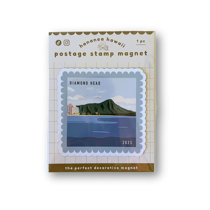 A postage stamp magnet product shown in its retail packaging on a white background. The package reads 'hawaii hawaii' and 'postage stamp magnet' with a sample stamp design featuring a green mountain and blue water labeled 'DIAMOND HEAD 2025'.