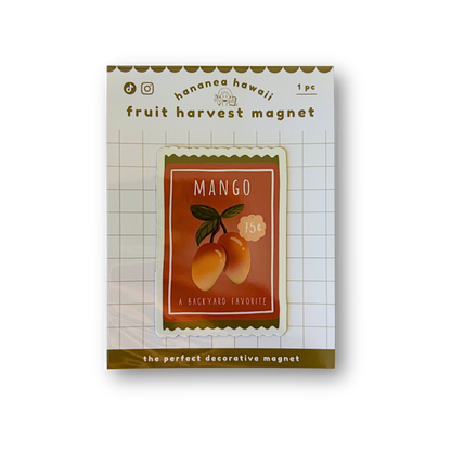 A packaged decorative fruit magnet labeled 'Mango', shown on a white background with product text and a small illustration of mangoes on the front.