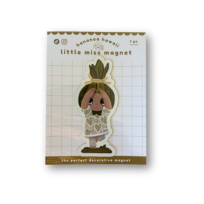 A decorative magnet featuring a cartoon character with brown hair.