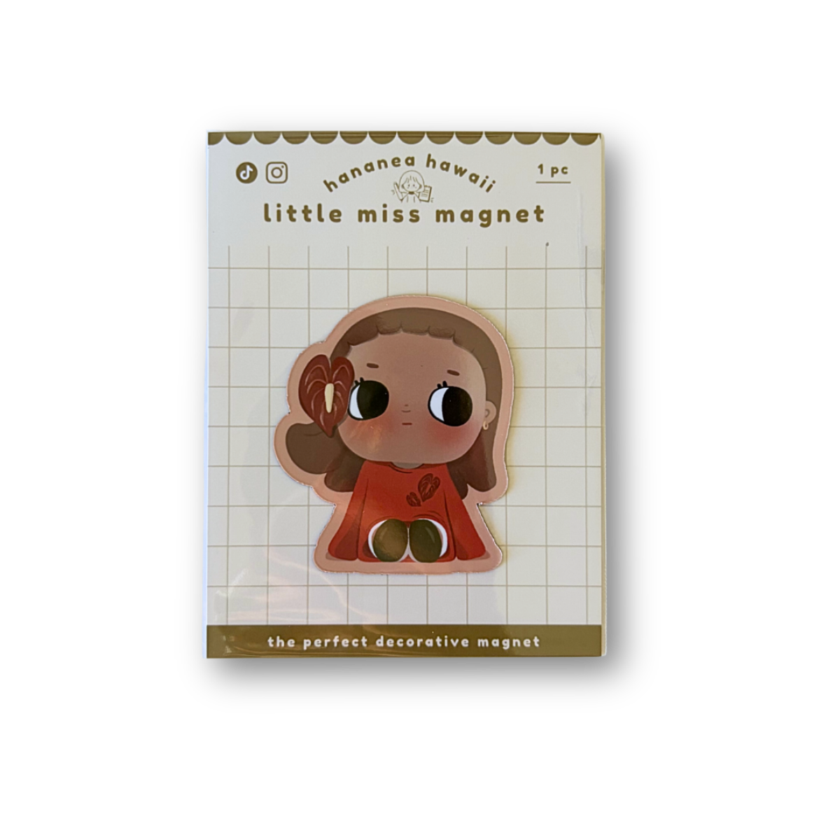 A cute decorative magnet featuring a cartoon girl on a white grid backing card, photographed against a plain white background.