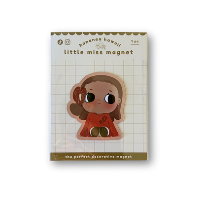 A cute decorative magnet featuring a cartoon girl on a white grid backing card, photographed against a plain white background.