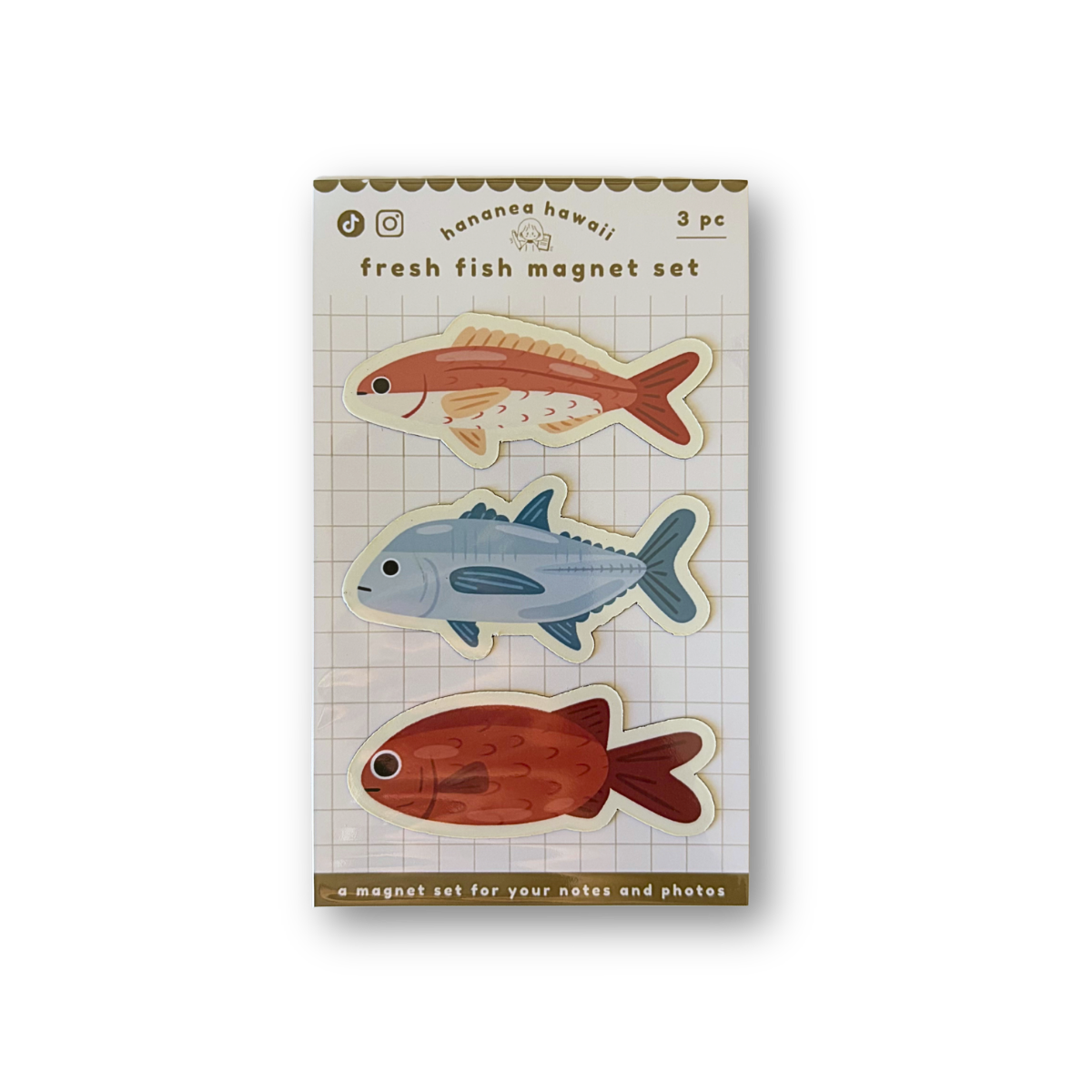 A package of three fish-shaped magnetic photo magnets on a white background. The package is labeled 'fresh fish magnet set' and shows three illustrated fish in orange-red, light blue, and rust red on a grid-patterned card.
