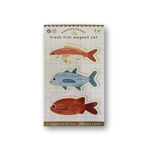 A package of three fish-shaped magnetic photo magnets on a white background. The package is labeled 'fresh fish magnet set' and shows three illustrated fish in orange-red, light blue, and rust red on a grid-patterned card.