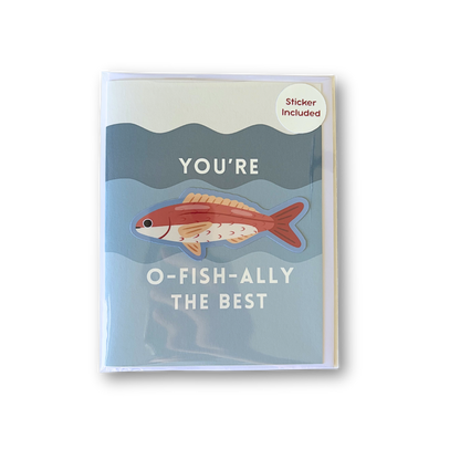 A greeting card with a light blue and gray underwater illustration, featuring a red-orange fish and the text 'YOU'RE O-FISH-ALLY THE BEST'. A small circular sticker in the top right corner reads 'Sticker Included'.