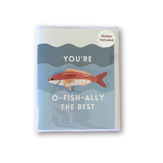 A greeting card with a light blue and gray underwater illustration, featuring a red-orange fish and the text 'YOU'RE O-FISH-ALLY THE BEST'. A small circular sticker in the top right corner reads 'Sticker Included'.