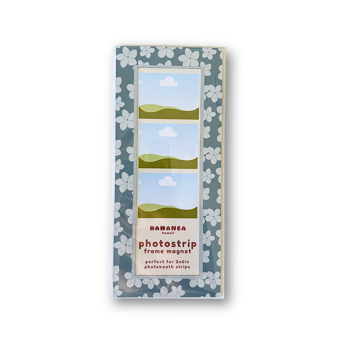 A photo trip frame magnet packaging, featuring a blue plumeria pattern.