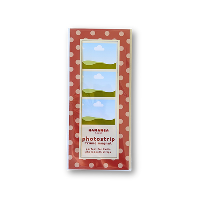 A packaged photostrip frame magnet, featuring a red and white polka dot border.