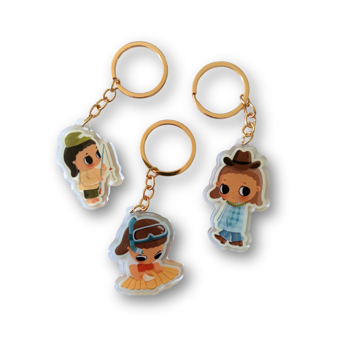 Three mini acrylic keychains featuring cartoon characters, each with a gold-tone split ring and chain, displayed on a clean white background.