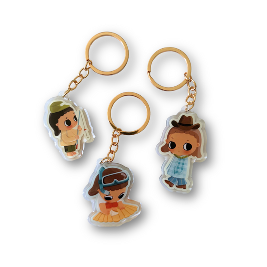 Three mini acrylic keychains featuring cartoon characters, each with a gold-tone split ring and chain, displayed on a clean white background.