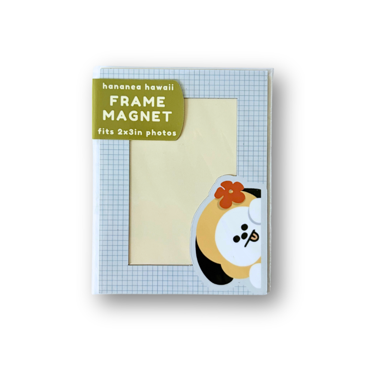 A Hananee Hawaii frame magnet shown in its retail packaging against a white background. The package contains a square magnet with a light blue grid pattern border, a beige center for a photo, a green label, and a cartoon character illustration.