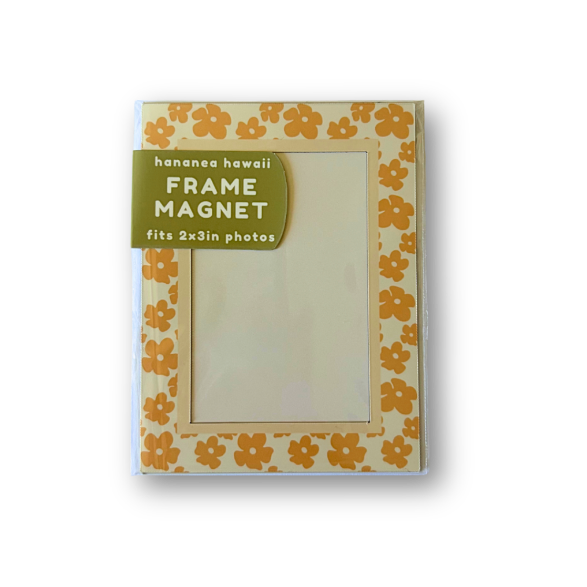 A packaged frame magnet, featuring a cream background with a yellow-orange puakenikeni border.
