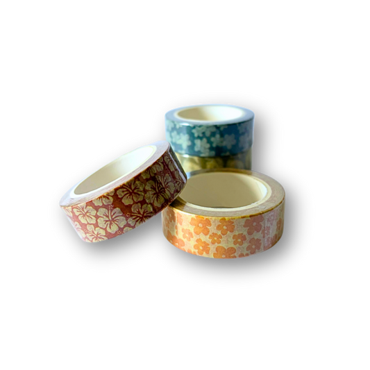 Three rolls of decorative washi tape with floral patterns, including one red and gold pattern, one orange and cream pattern, and one blue and white pattern, arranged on a white background.