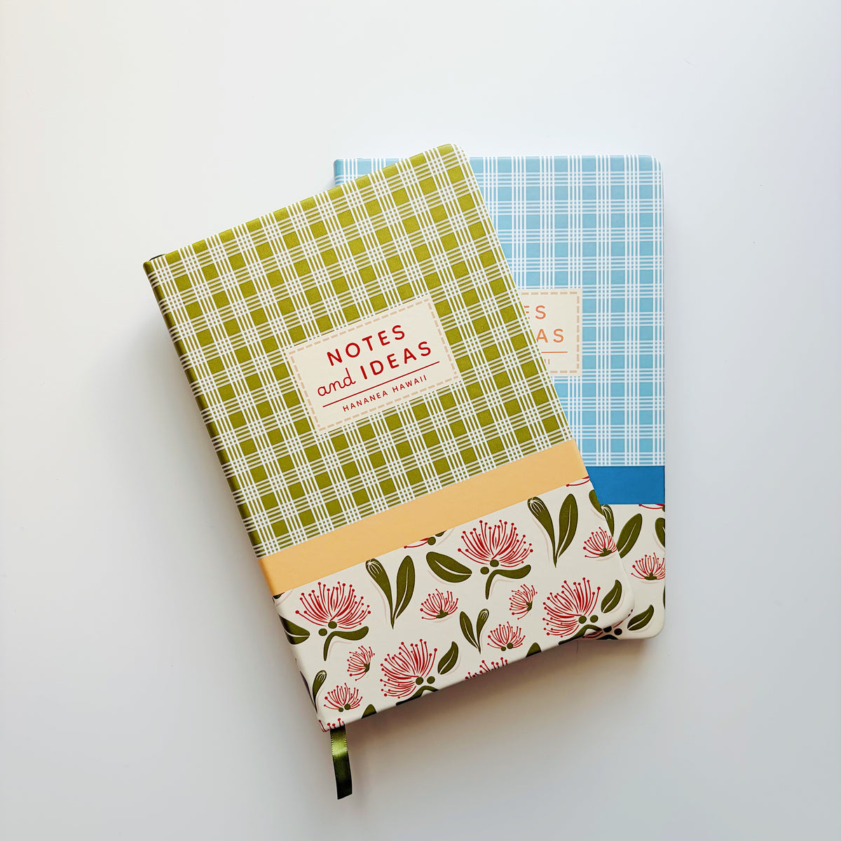 Two patterned hardcover notebooks on a clean white background. 