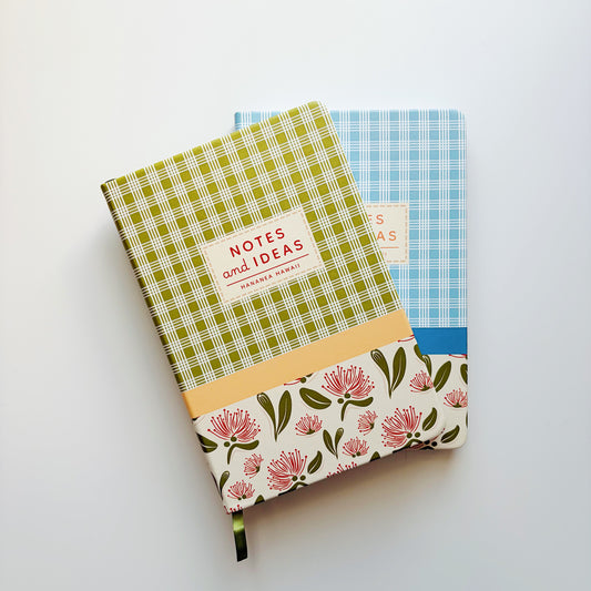 Two patterned hardcover notebooks on a clean white background. 