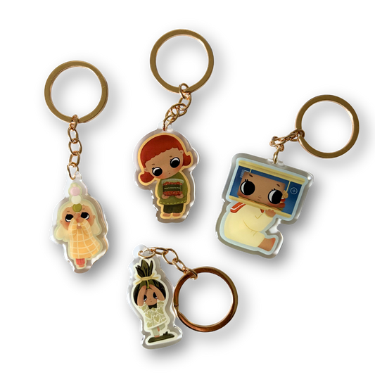 Set of four cartoon character keychains on a white background