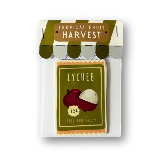 Packaged lychees with 'Tropical Fruit Harvest' branding on a white background