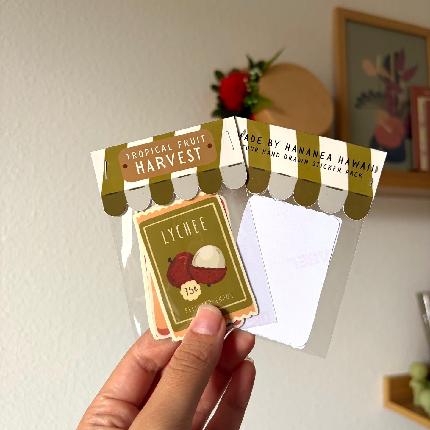 tropical fruit harvest sticker packs against a beige background