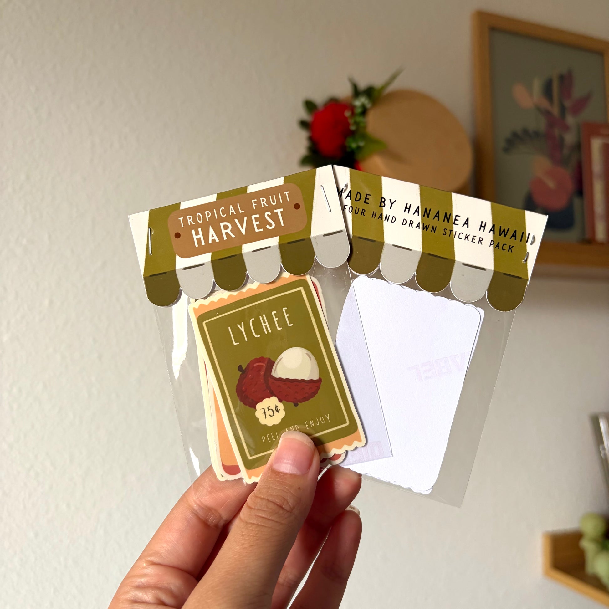 tropical fruit harvest sticker packs against a beige background